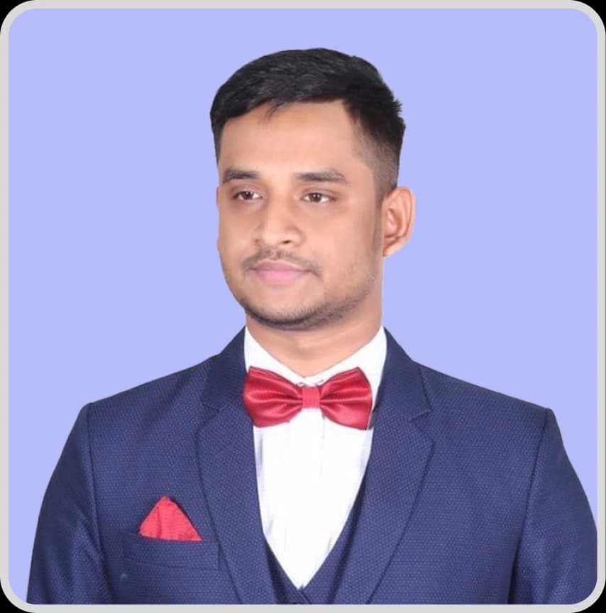 A man in a blue shirt stands with arms crossed, representing Debabrata Bhowmick, Full Stack Developer at Rankupper.