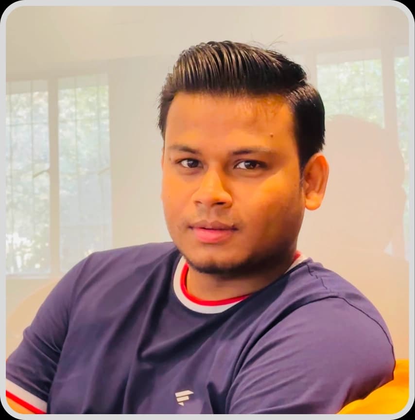 A man in a blue shirt stands with arms crossed, representing Hasan Mahbub, Senior Executive, Business Development at Rankupper.