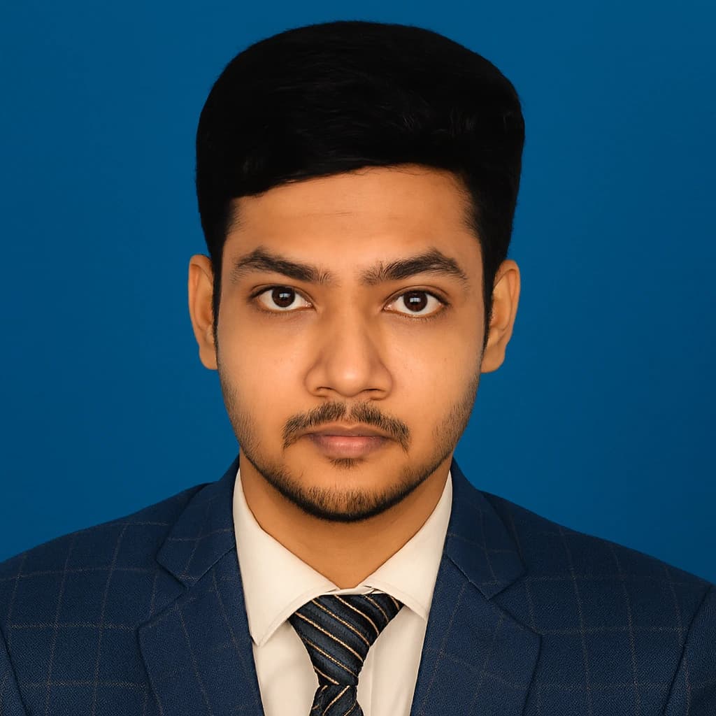 A man in glasses and a suit stands with arms crossed, representing Junior SEO Specialist Md Shahin Rankupper.