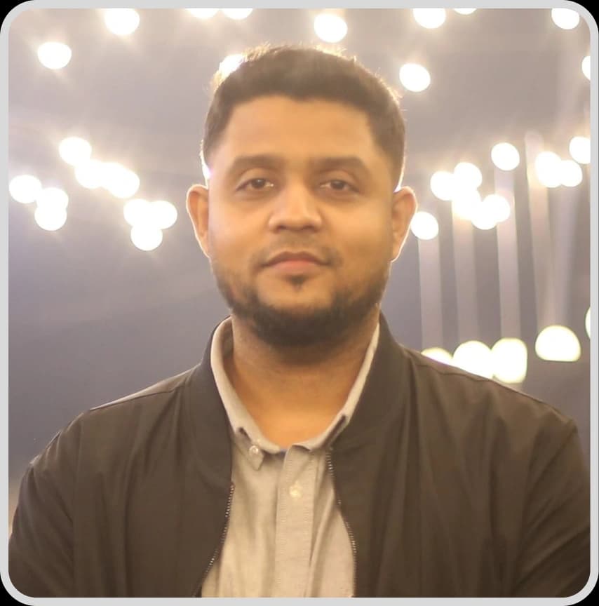 A bearded man in a black shirt, representing Head of Content Marketing Ruzel Hasan from Rankupper.