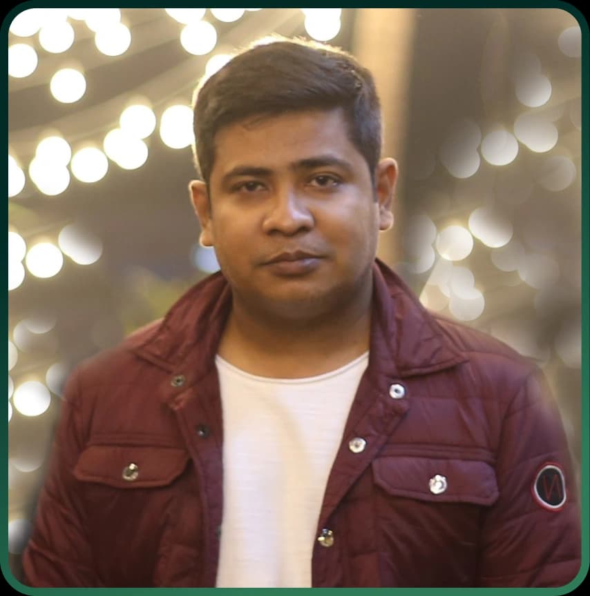 Chairman Sumon Chowdhury rankupper stands confidently in a blue suit and tie, arms crossed, conveying authority.