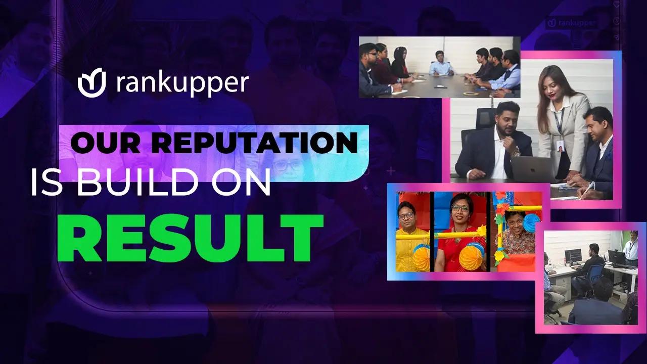 A man and woman stand together in front of a computer, engaged in a work process on the Rankupper.