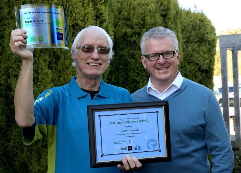 two man celebrating their cleaning business achievements